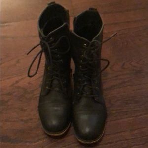 Lace up combat boots.